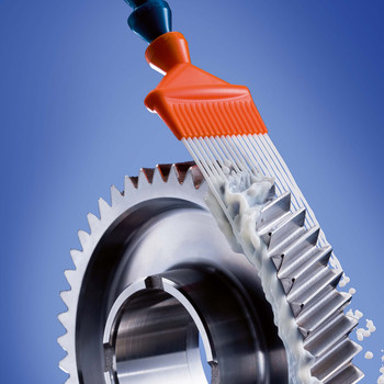 Water-miscible cooling lubricant sprays out of a nozzle