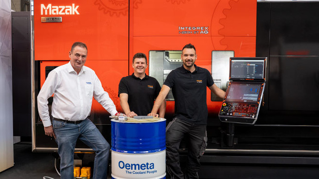 Oemeta and Mazak in front of a machine tool