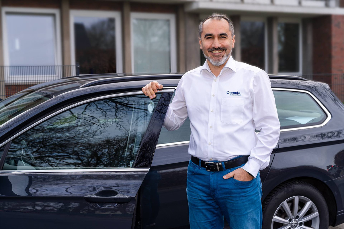 Sales representative in front of car 