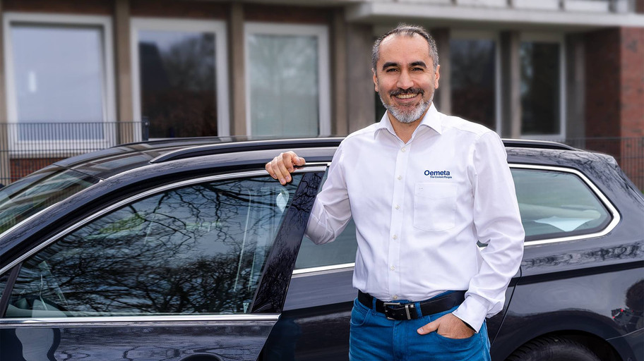 Sales representative in front of car 