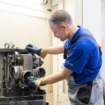 Worker handles a gear