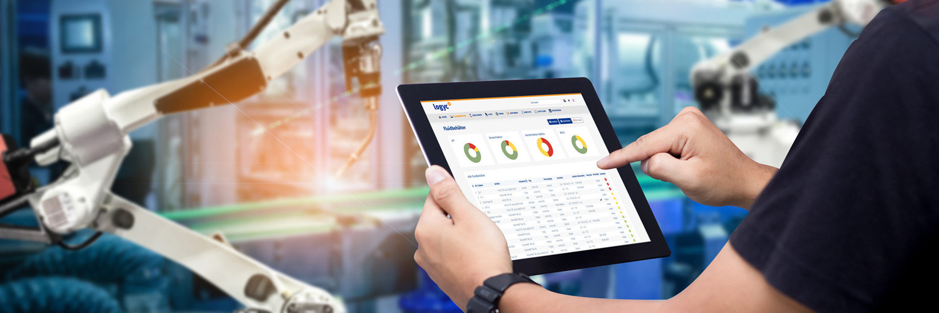 Man monitors metalworking fluids with tablet in hand